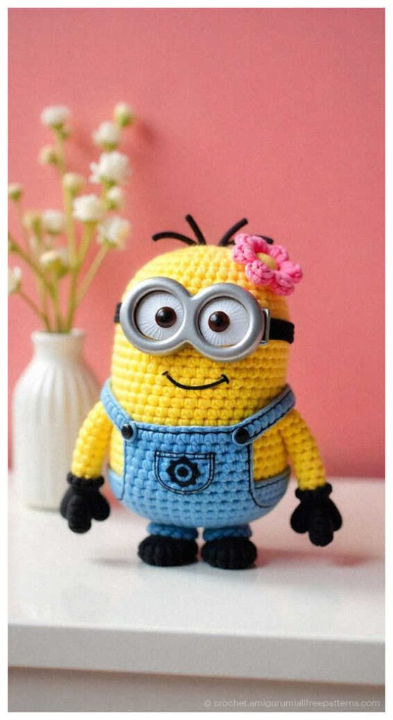 This beginner-friendly crochet project shows a character with basic stitches and easy-to-follow proportions. The contrast between the yellow skin and blue clothes is clear and visually appealing. This image is part of our collection of beginner ideas.