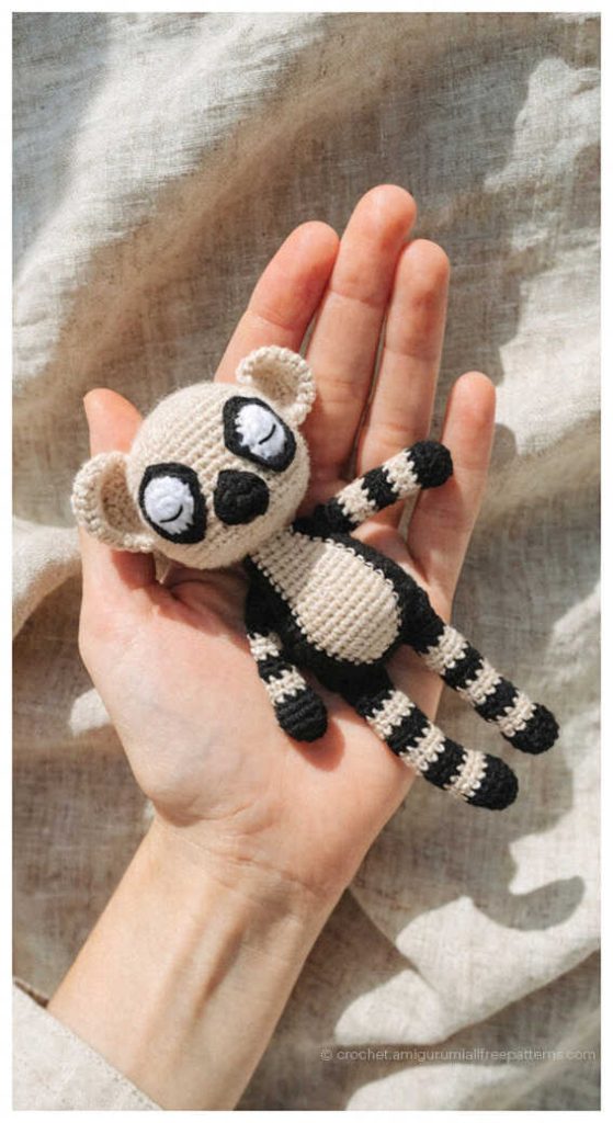 cute lemur amigurumi toy with striped tail held in hand adorable crochet lemur gift idea for animal lovers