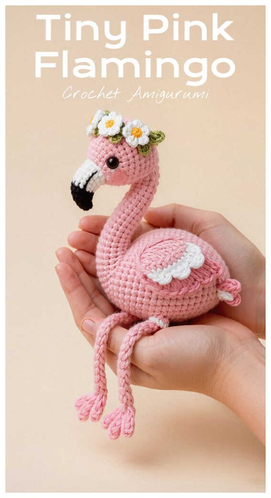 tiny pink flamingo amigurumi sitting in hands with flower crown cute crochet bird idea