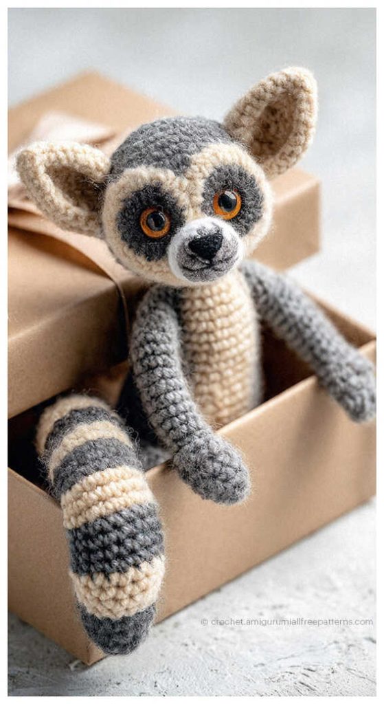 striped tail lemur amigurumi sitting in a box adorable crochet animal toy inspiration for nursery decor