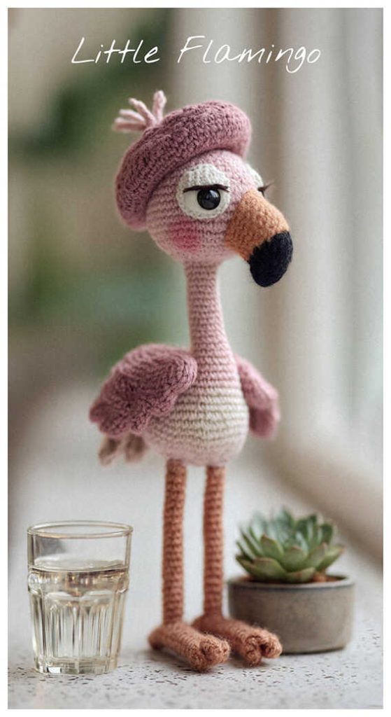 little flamingo amigurumi wearing a tiny beret standing on long legs cute pink crochet bird idea