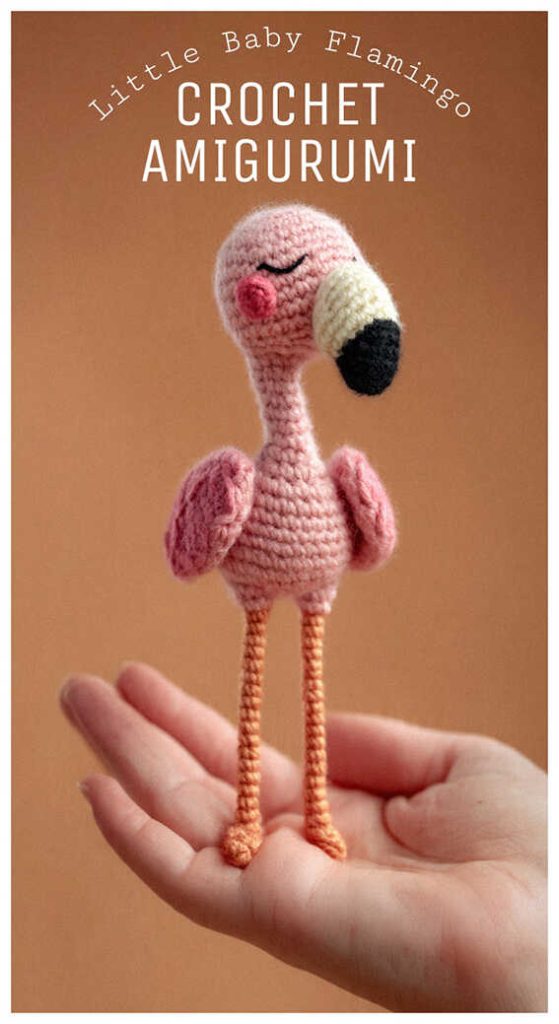 little baby flamingo amigurumi standing on a hand long leg pink crochet flamingo plush idea