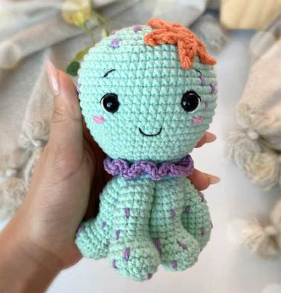 cute octopus amigurumi crochet doll free pattern small handmade sea toy held in hand