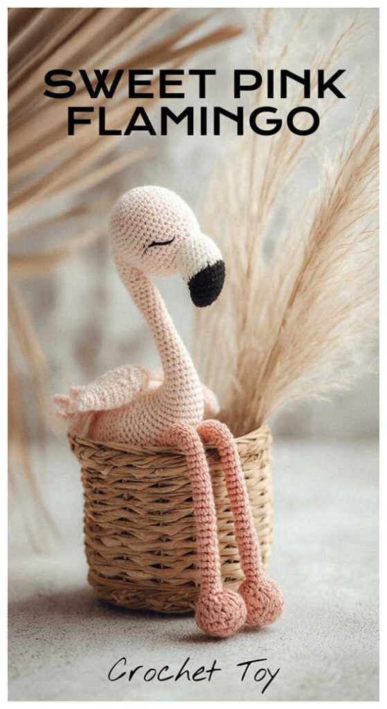 sweet pink flamingo amigurumi sitting inside a wicker basket long leg crochet flamingo idea