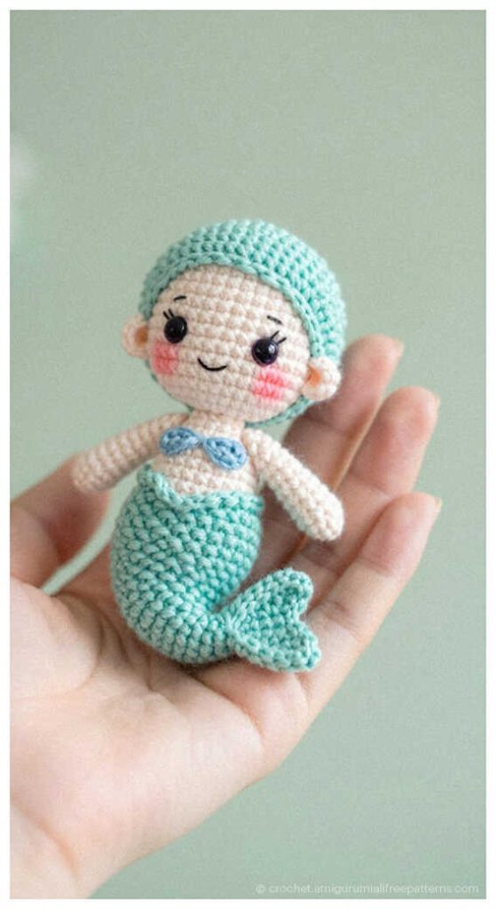 tiny mint mermaid amigurumi doll in hand adorable handmade crochet sea character toy
