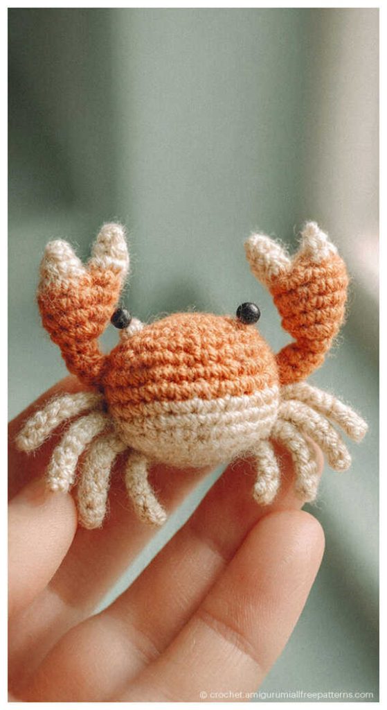tiny crab amigurumi crochet toy in hand you will want to make this cute ocean project